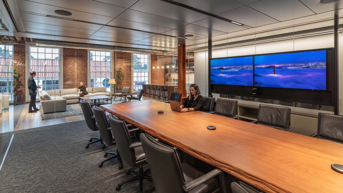 woman working in open meeting room and view of lounge