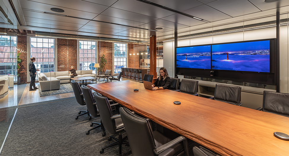 woman working in open meeting room and view of lounge