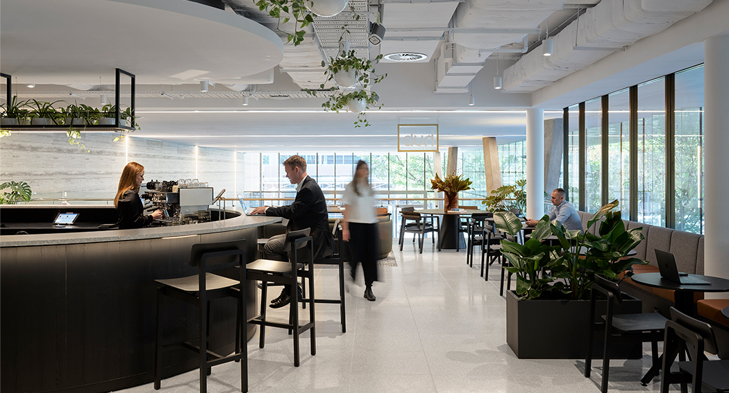 People in casual space around reception desk