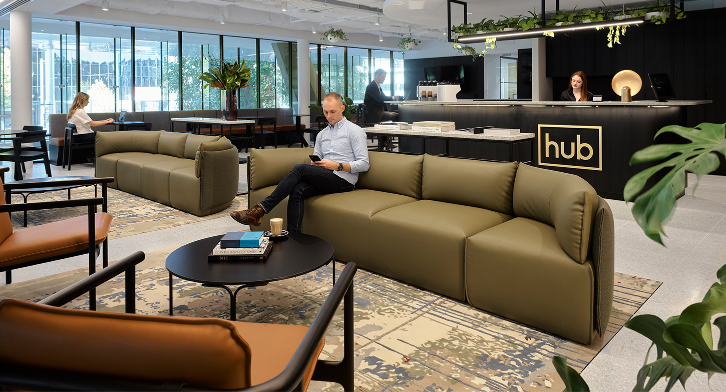 reception and man sitting in lounge area