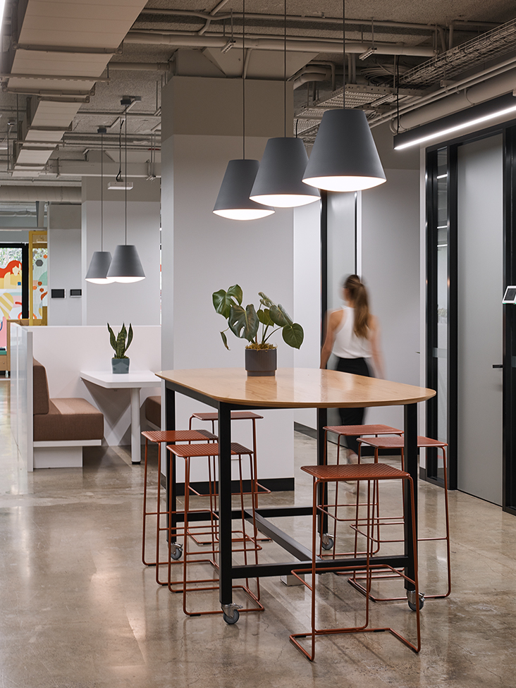 casual seating area and woman walking
