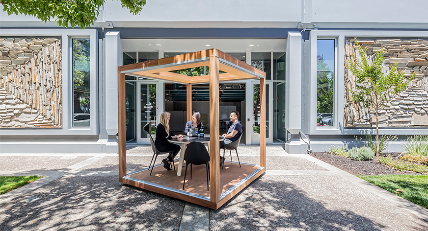 people working outdoor in framed wooden booth