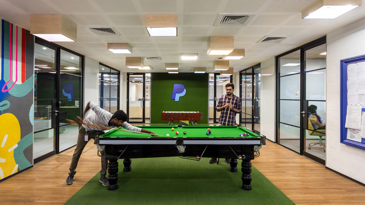 people playing pool, logo in background