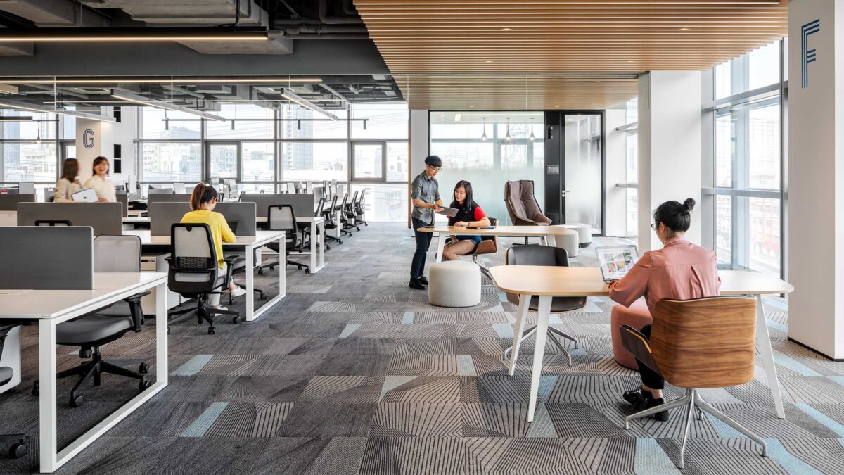 people working on open plan work floor