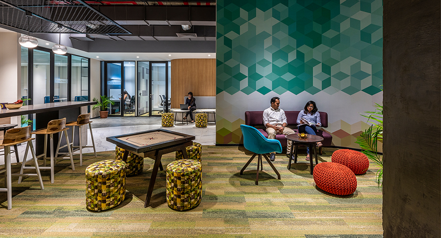 man and woman collaborating in casual space
