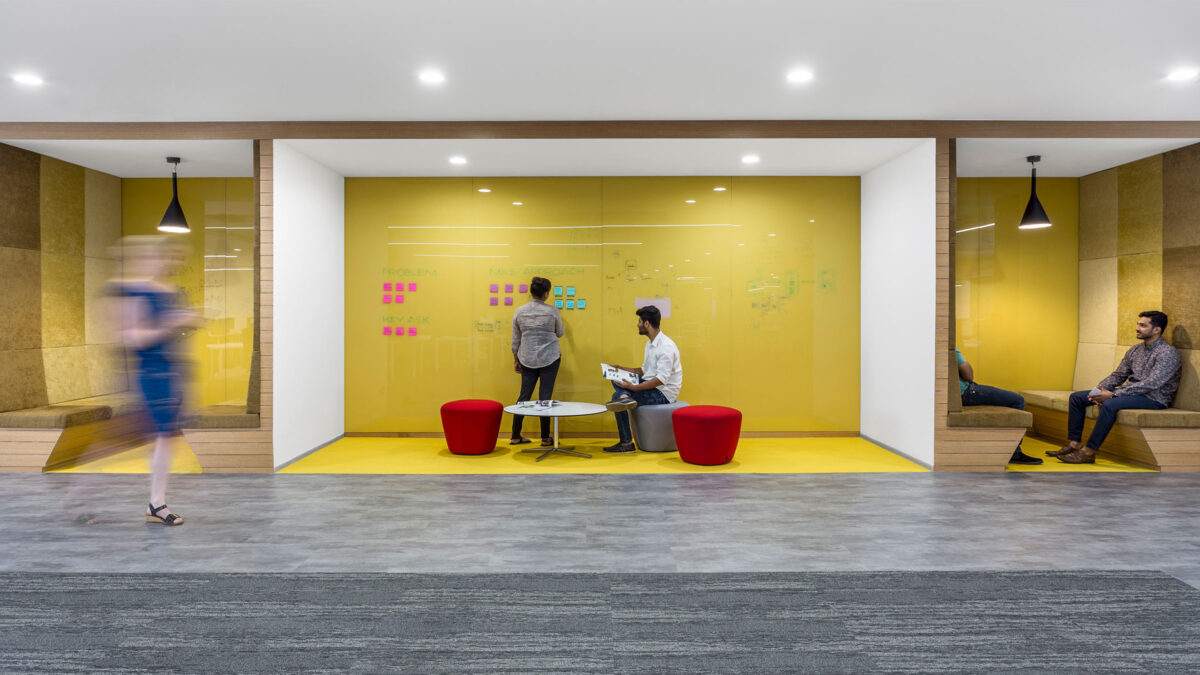 people collaborating in a booth