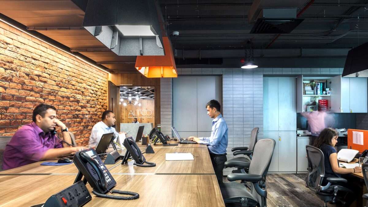 people working on open work desk