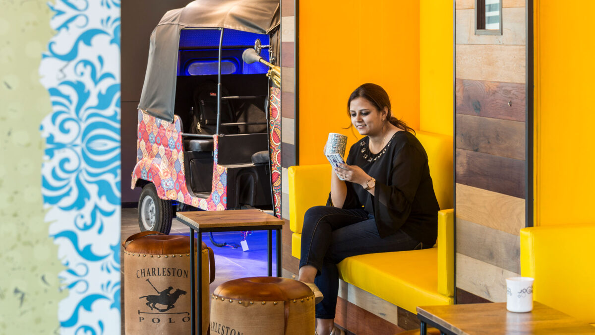 woman sitting on bench near rickshaw