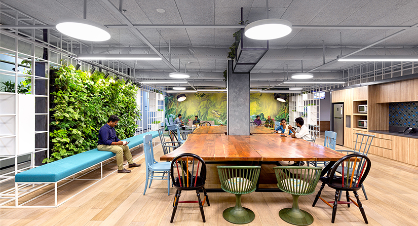 people at tables in kitchen area