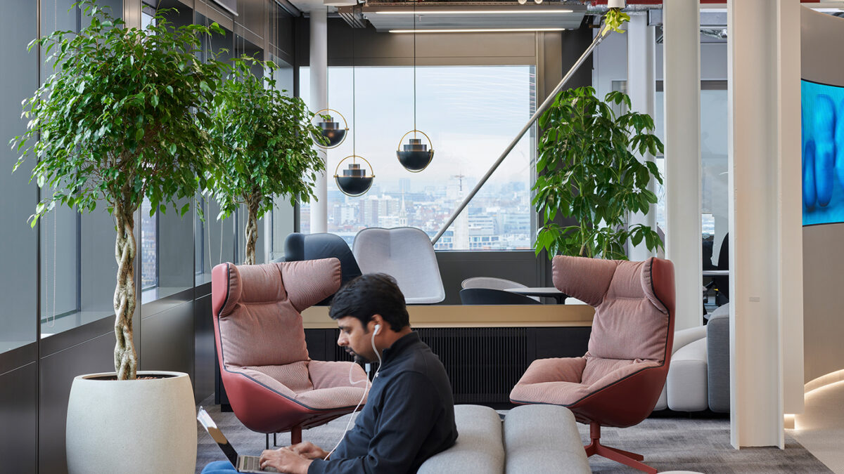 man working in casual seating area large version