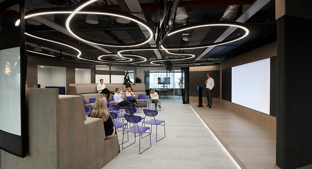 man giving presentation to colleagues in 