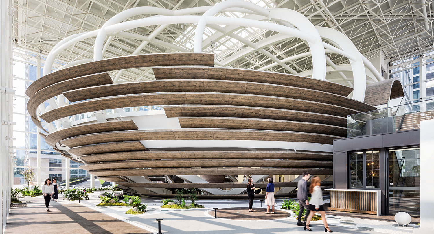 people walking around spherical dome staircase
