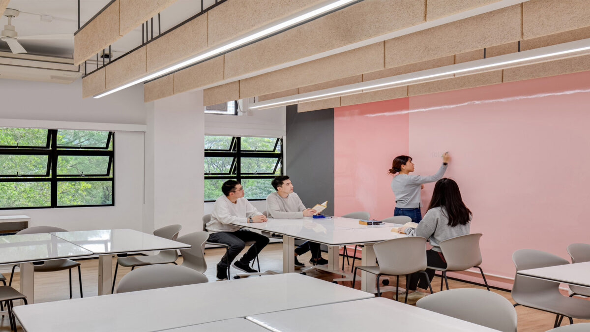 students writing on walls in classroom