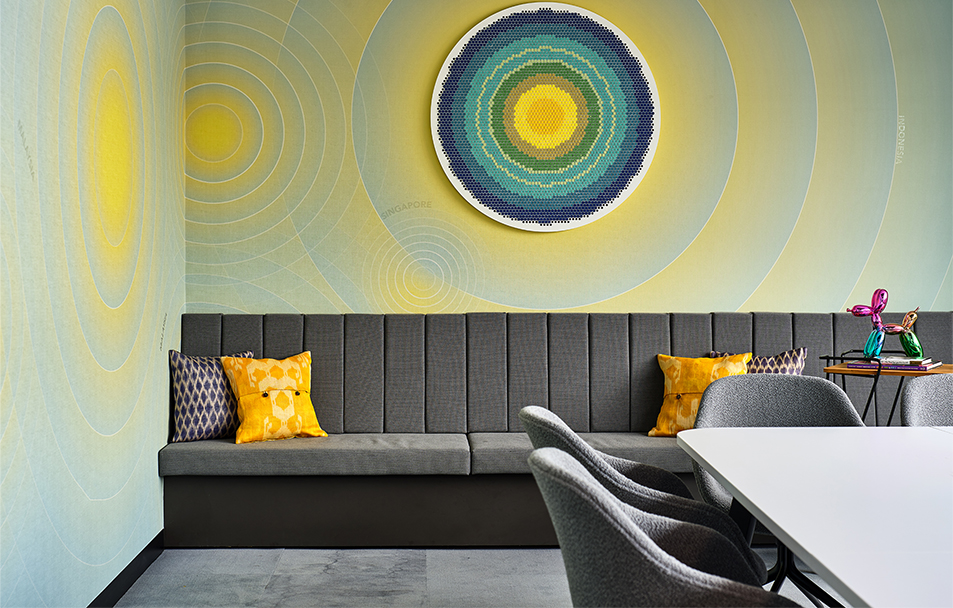 colour wall art above long chair and table
