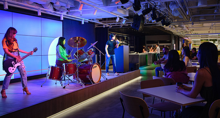 band playing in front of seated audience