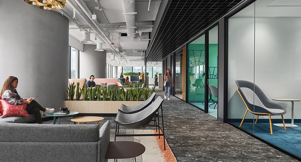 woman on phone in breakout casual area
