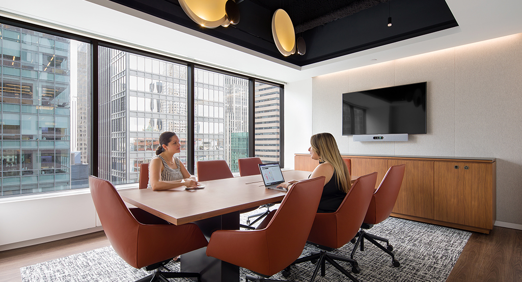 women collaborating in boardroom