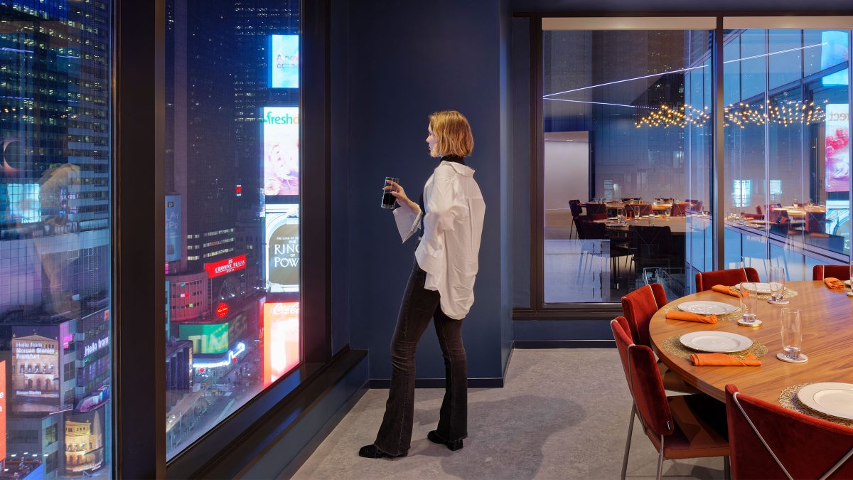 A heightened employee experience design by M Moser in New York city featuring views of Times Square.