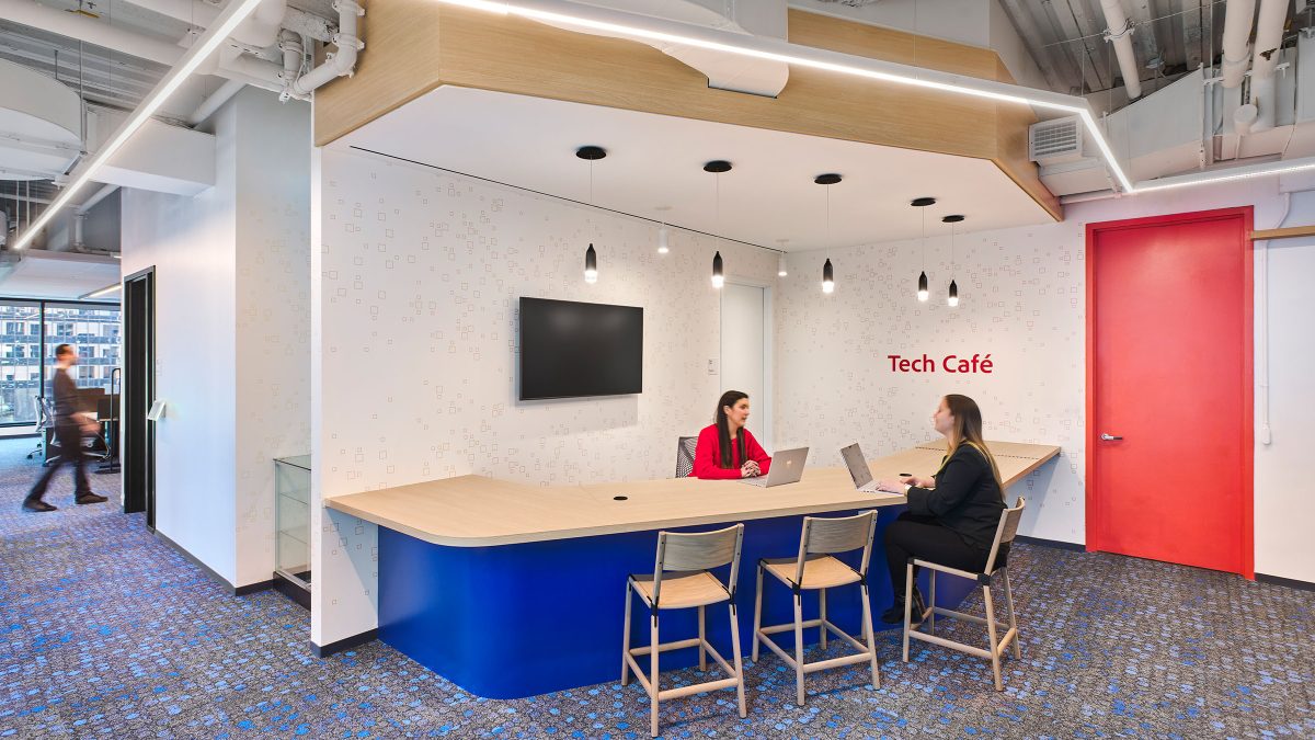 Tech café design by M Moser Associates featuring a unique location for employees to seek IT and technology aid.