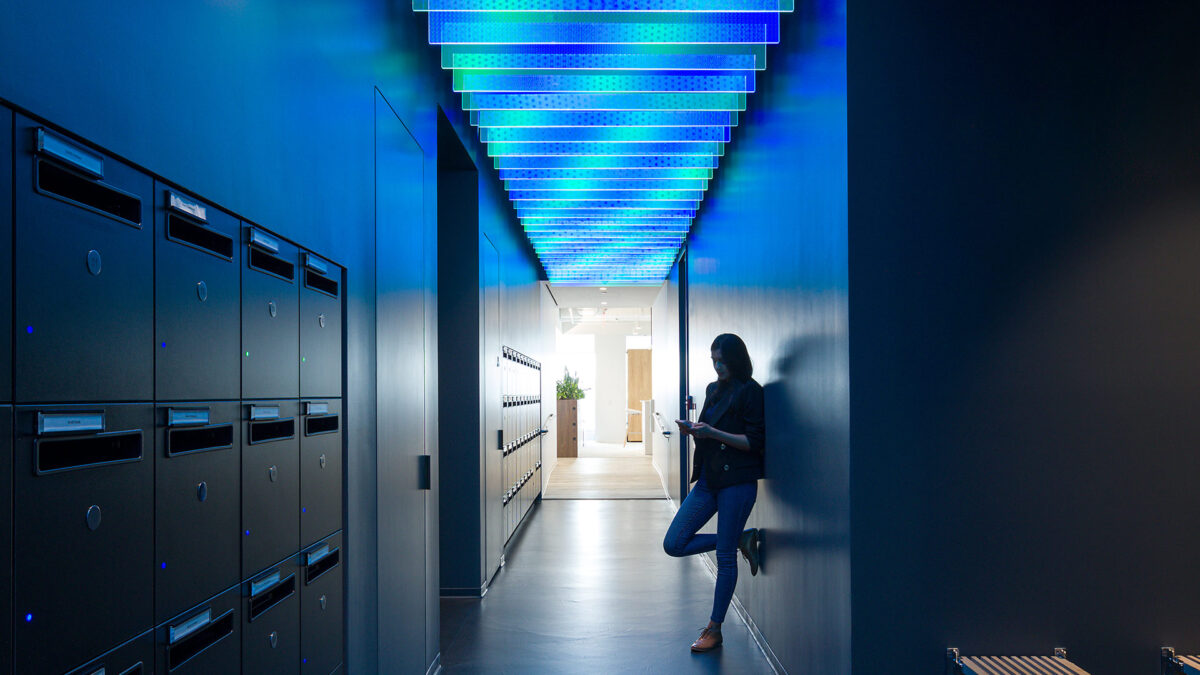 dark corridor in office with blue feature ceiling