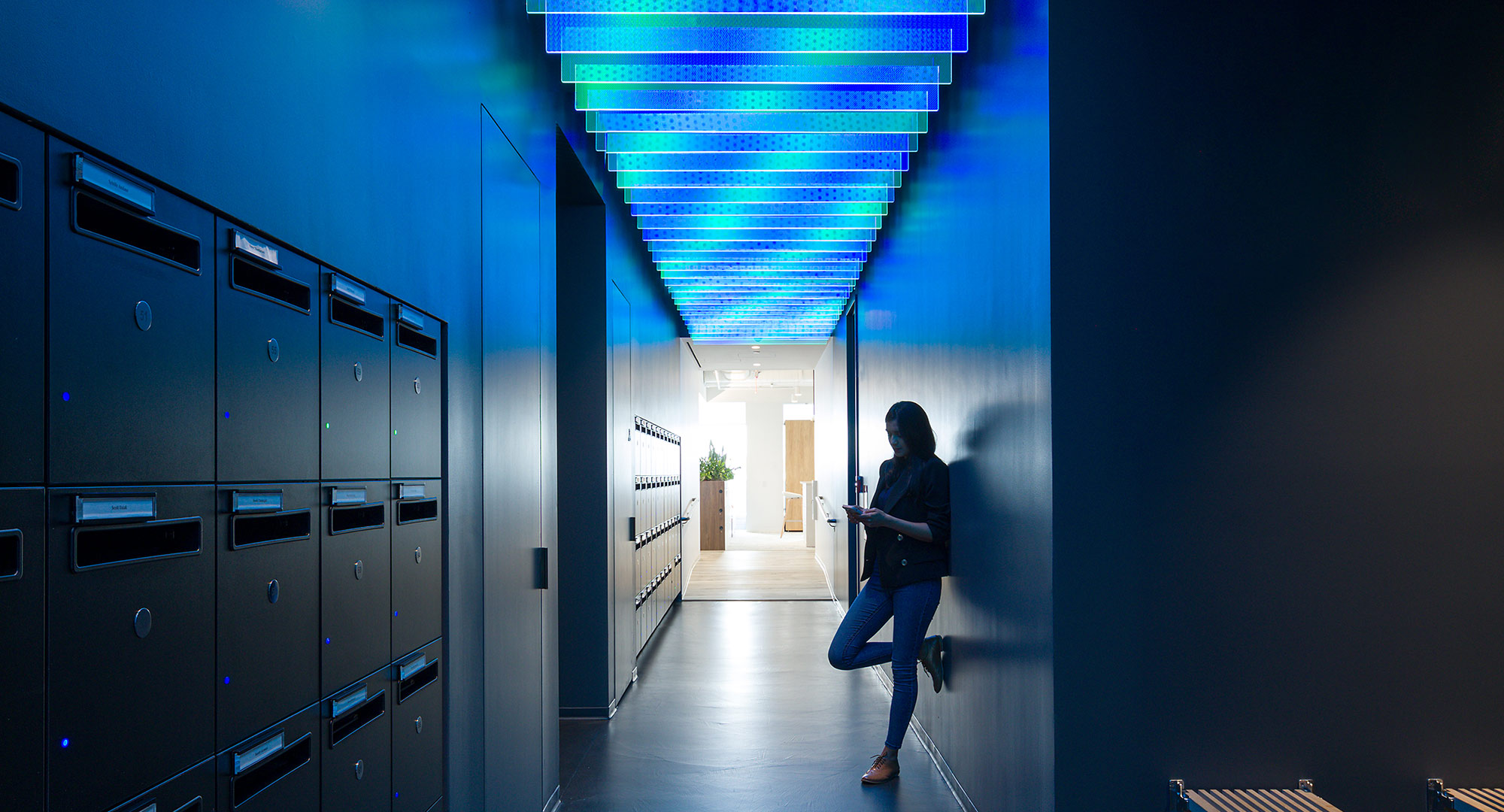 dark corridor in office with blue feature ceiling