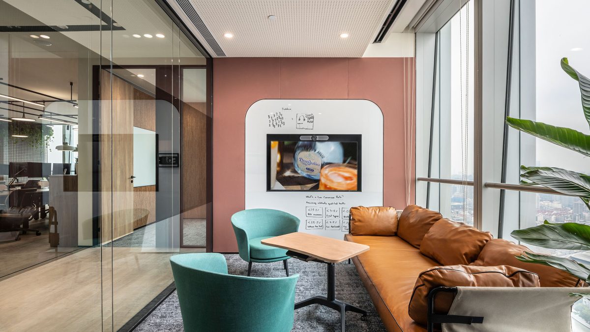 workplace seating area with orange couch 