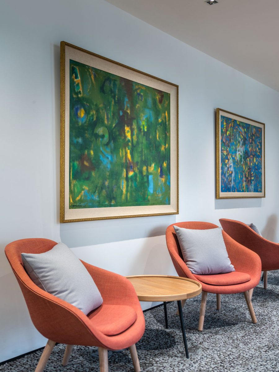 Office common area with elegant orange chairs