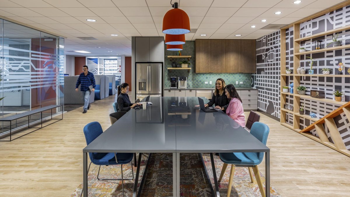 Office design inspiration by M Moser featuring a large, open coworking space and meeting and collaboration area with custom interior design, ergonomic seating and office kitchenette.
