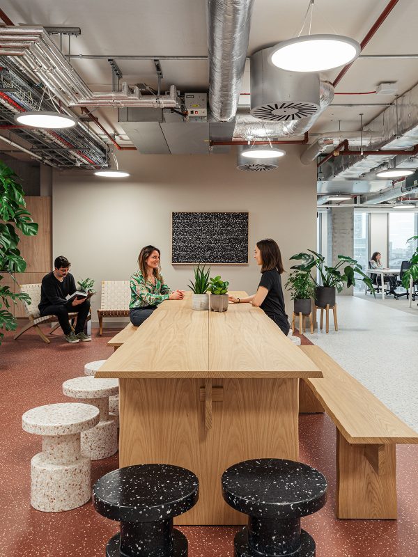 two-people-sat-at-large-bench-seating