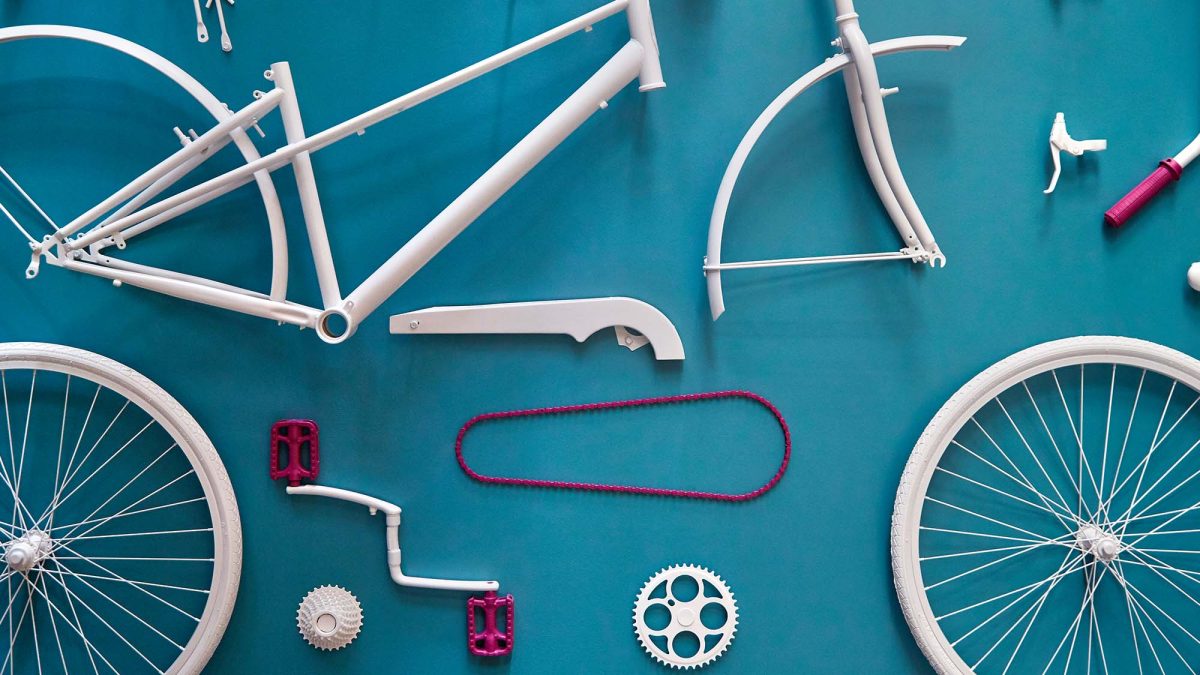 Art installation by M Moser for San Francisco Bay Area client features unique display of bike parts.