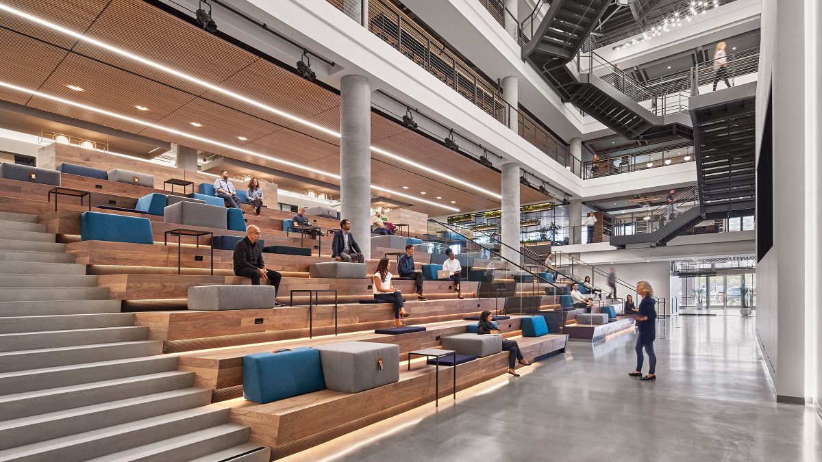 Modern office design by M Moser in San Francisco featuring a large auditorium with unique seating for team building and town hall events.