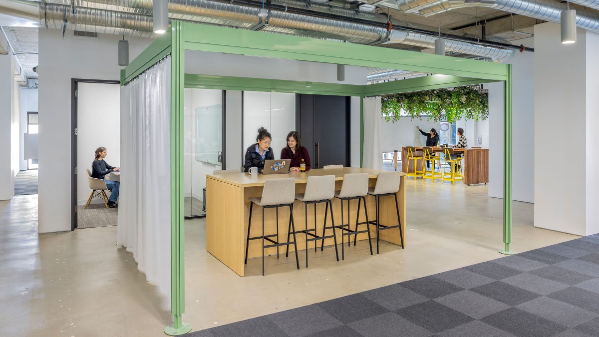 Innovative office design that brings in elements of plants and living walls to improve the employee experience in the office.