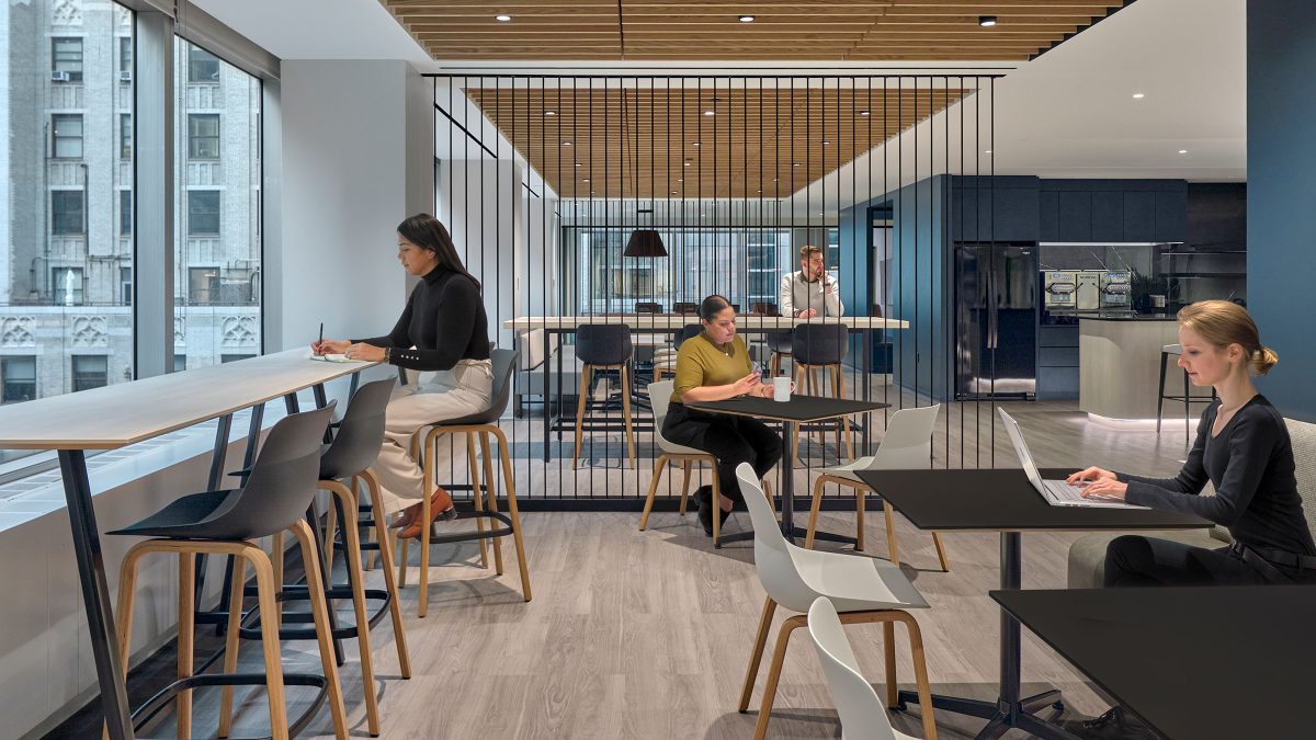 Multi-purpose café-style seating in the office where employees can work, relax and sip coffee during their breaks.