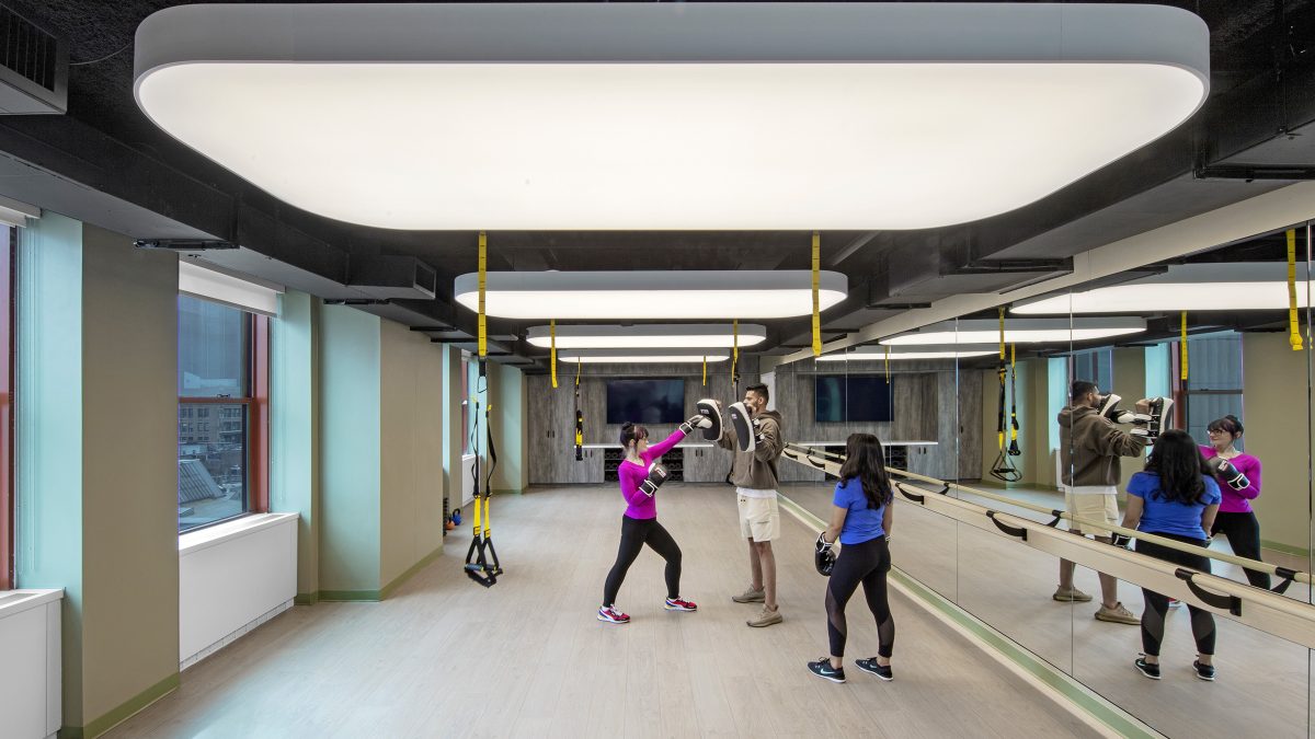 Multi-purpose amenity space and wellness room where employees can exercise and build important relationships at work.