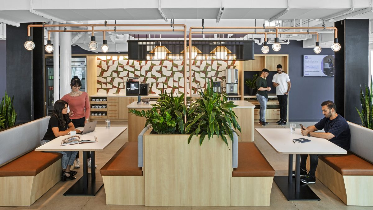 Dynamic workplace environment at LinkedIn’s headquarters in New York City by M Moser Associates featuring a kitchen that doubles as a work setting for individual or collaborative working styles.