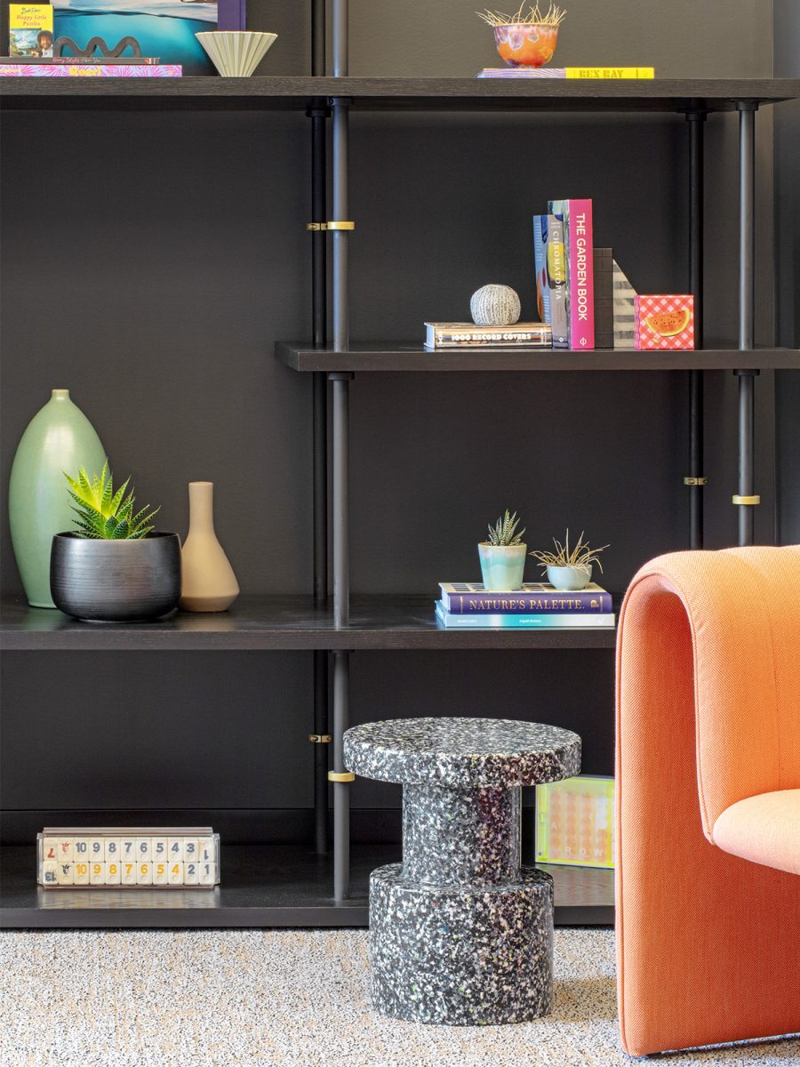 A focus on sustainable materials featuring terrazzo side table and plush accent chair in a casual work setting at LinkedIn New York.