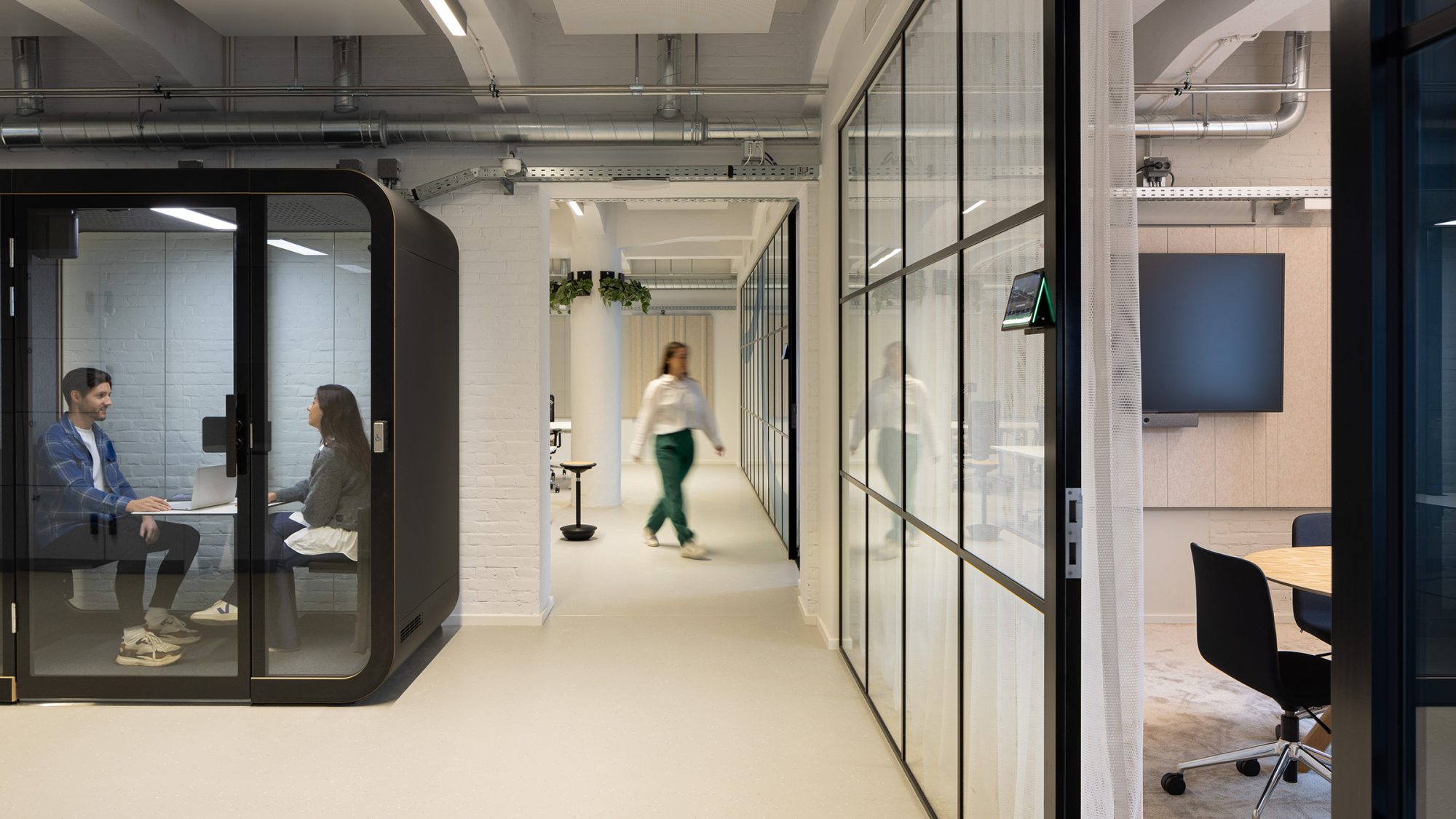 Focus booths lining corridor of office