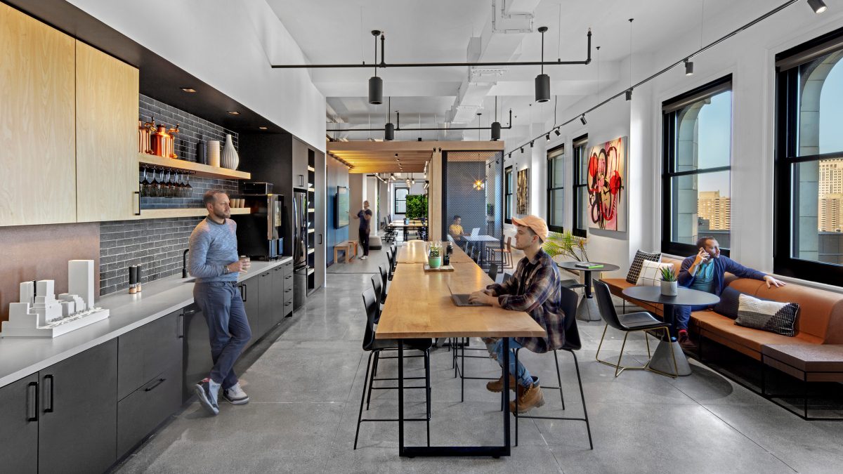 M Moser's New York office design featuring a flexible work and kitchen area for socialising and collaborating. 
