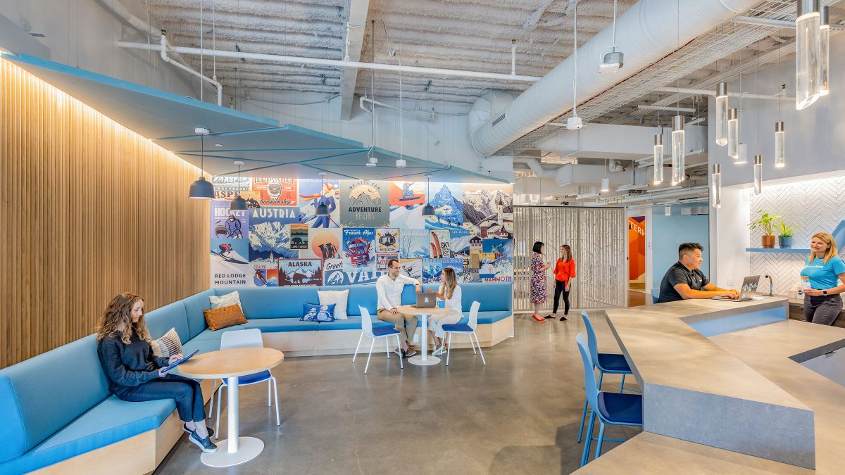 Central pantry hubs on each office wing offer places to recharge with snacks and sparkling water, activated by warm finishes and themed graphics.