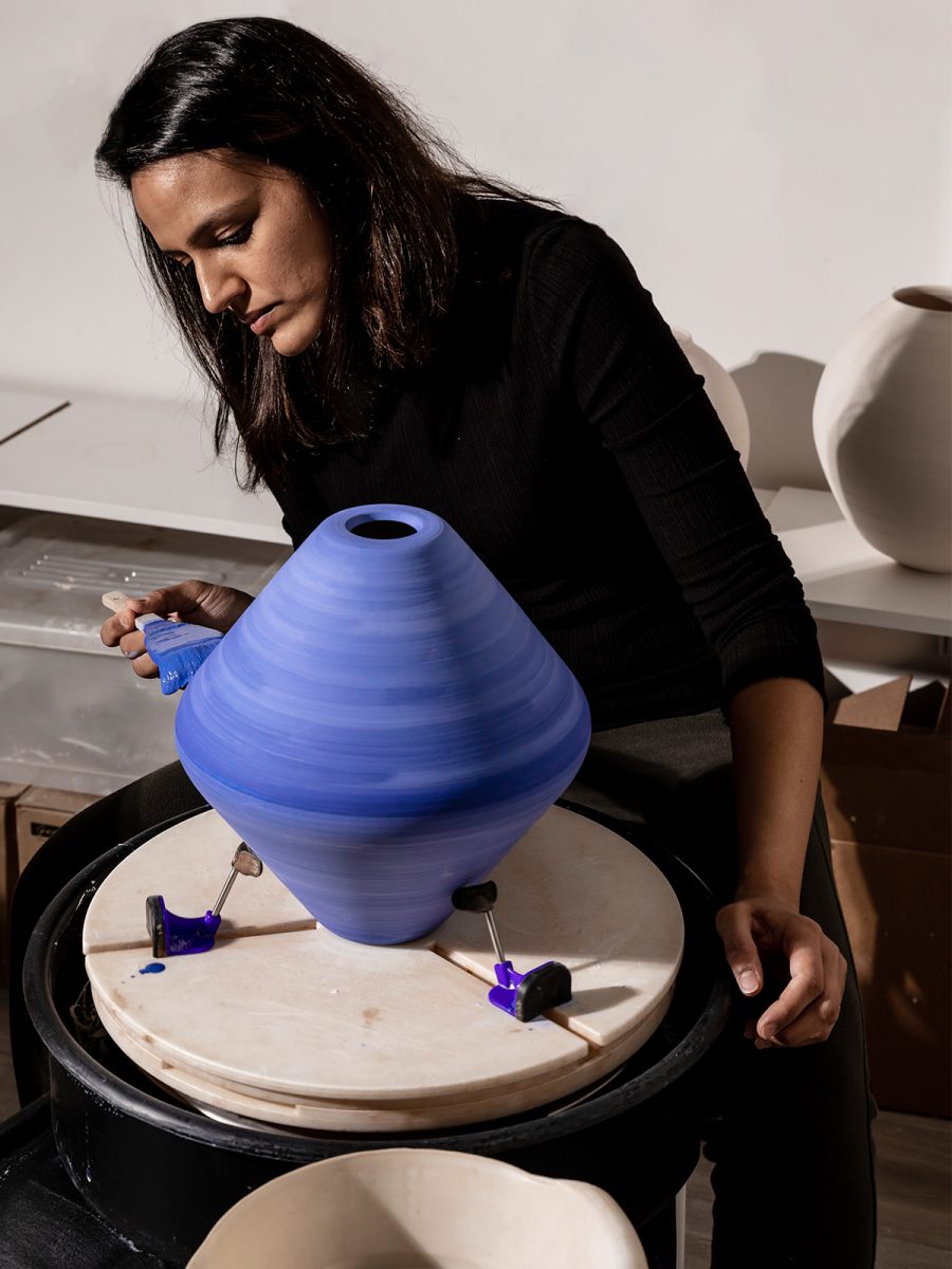 Tanvi Arora in her ceramic studio hand-painting the clay beads for M Moser’s design of Tipalti’s office in Vancouver.