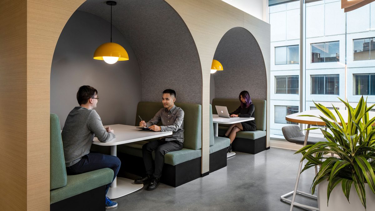 A workplace featuring comfortable, hospitality-like furniture, booth seating, amenities and installations to welcome employees back to the post-pandemic workplace.