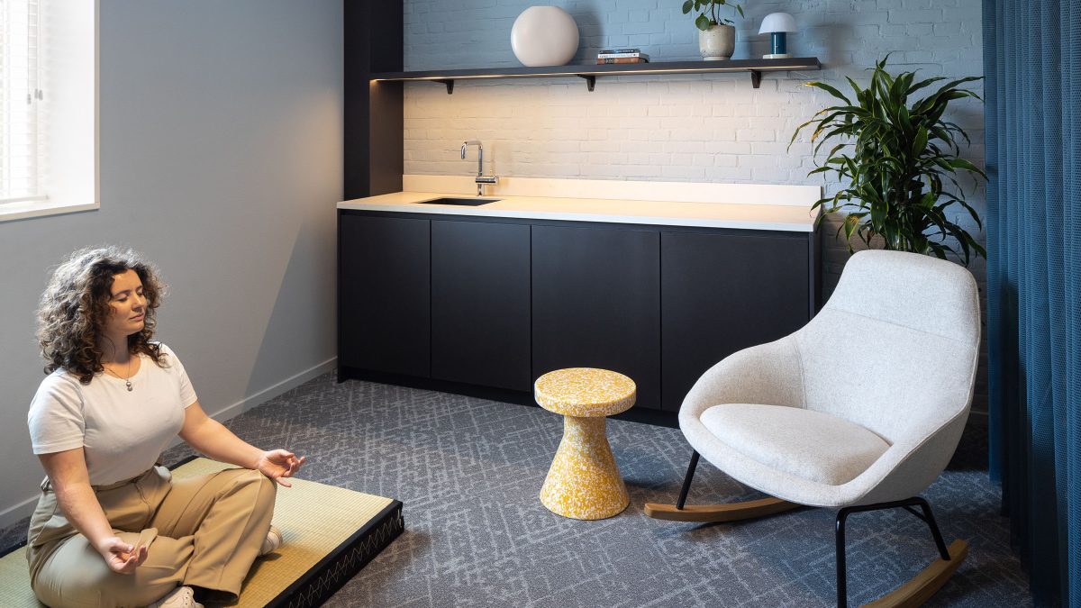 Woman meditating in wellness and mother's room