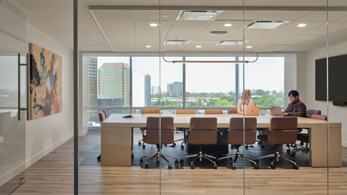 Office interior design for a music industry giant in Los Angeles featuring a brightly lit meeting room, ergonomic office furniture and artwork.