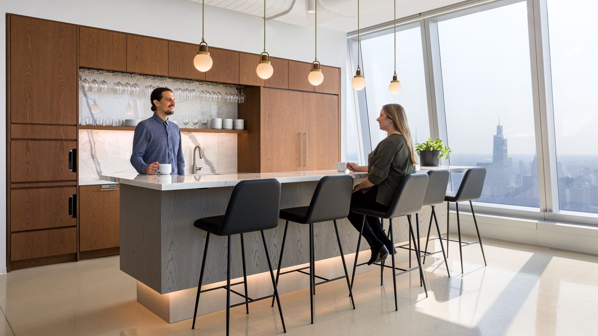 people socialising at teapoint in office design for DNB