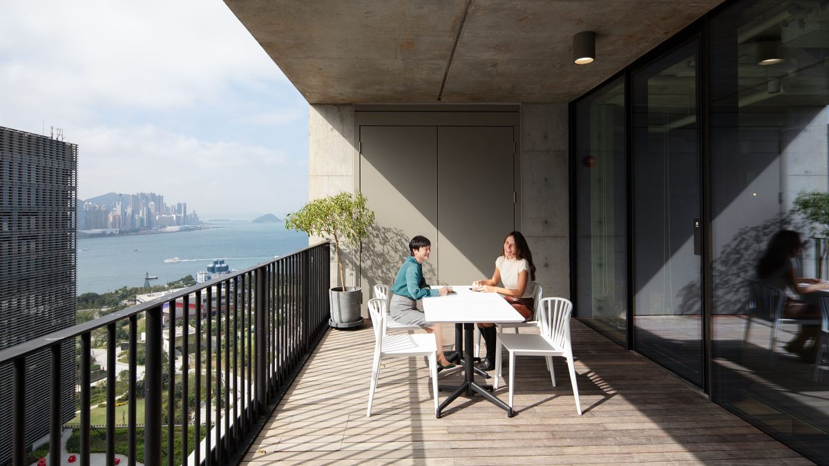 people working on outdoor terrace