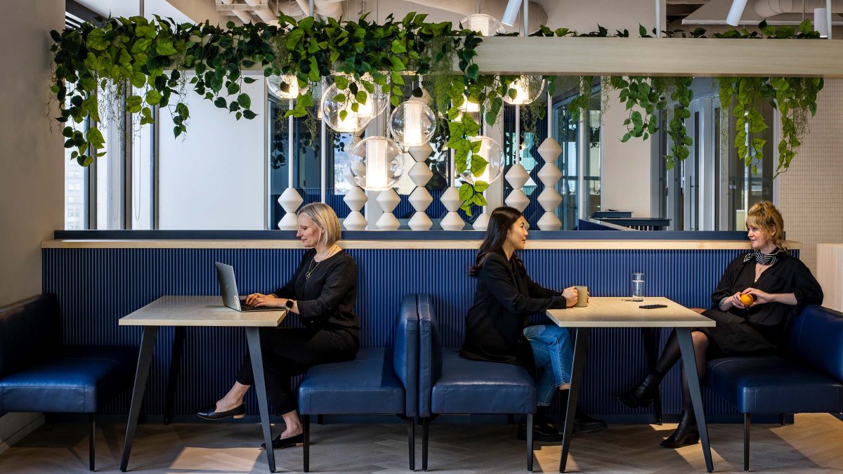 Tipalti workplace in Vancouver features a vibrant kitchen painted blue and comfortable benches to lounge or work from.