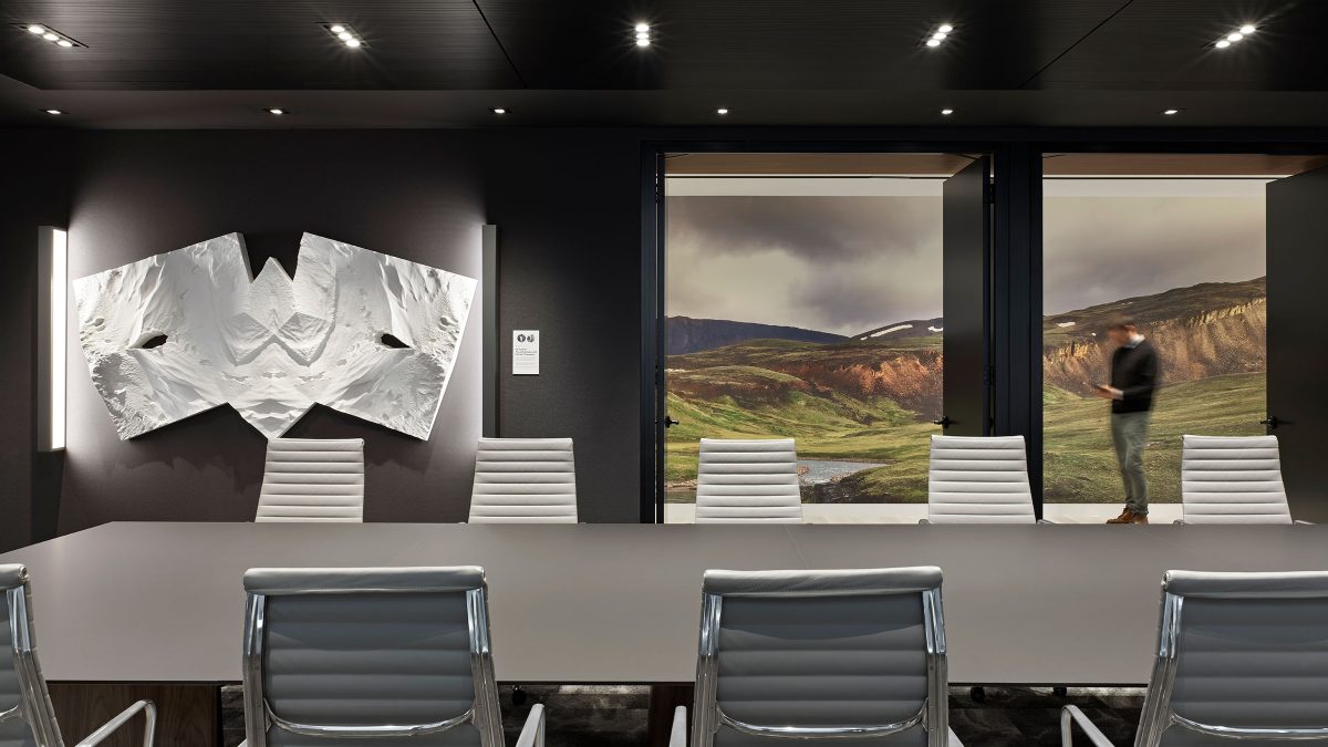 Boardroom design by M Moser Associates featuring ergonomic office chairs, artwork and soft lighting.
