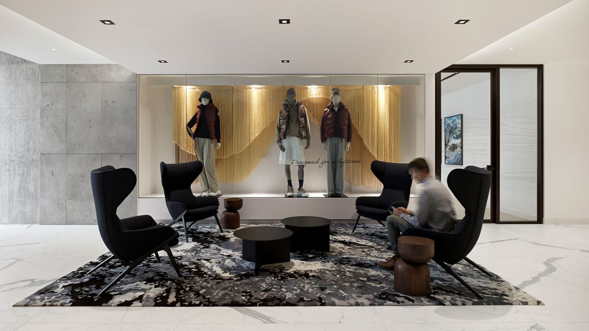 Interior design by M Moser featuring a branded lounge for employees to have casual meetings.