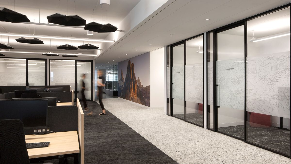 Branded installations and office design featuring unique artwork and private phone booths to improve the employee experience.
