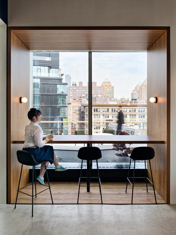 Office design by M Moser in New York featuring alternative employee work settings for casual meetings or heads down work. 